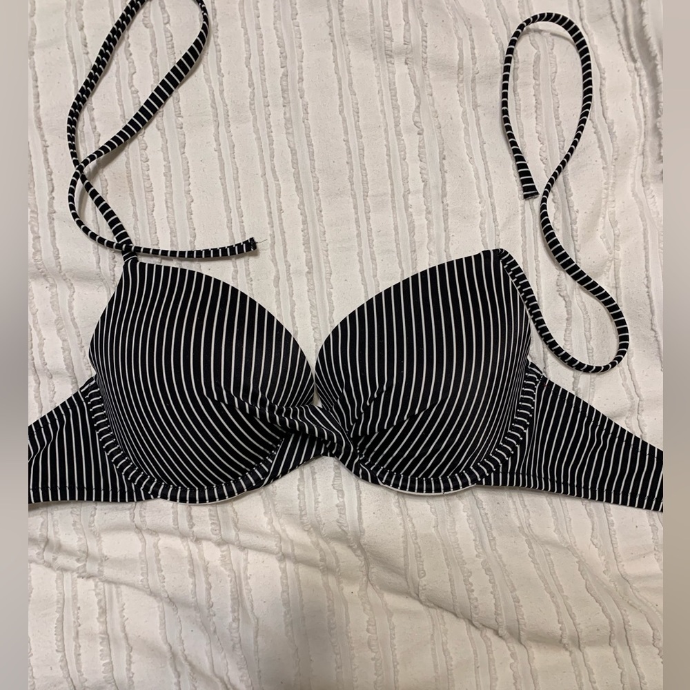 A blacked striped bikini top